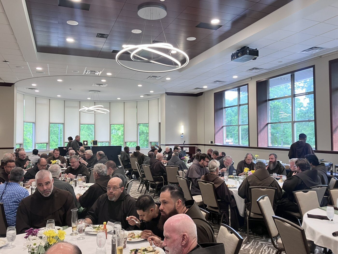 Friars share a meal at the Franciscan gathering